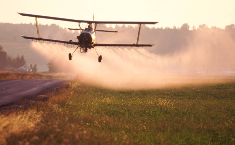 Spraying biocides on crops