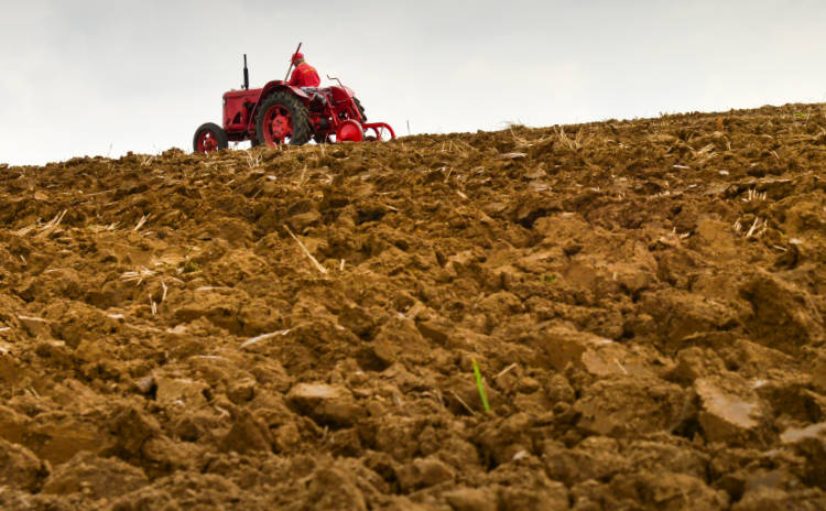 Tractor plowing soil